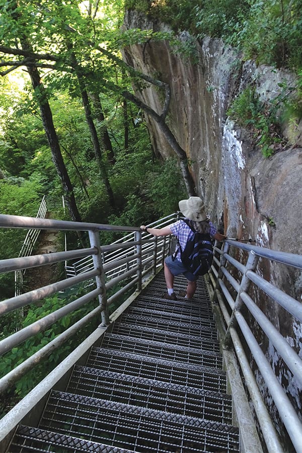 Steep metal steps lead to Bluff Trail, where Lookout Mountain’s wooded slope gives way to high cliffs.
