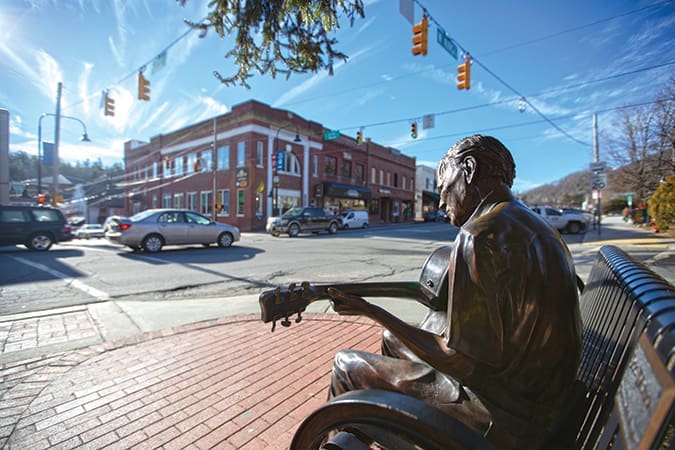 See the Doc Watson statue in Downtown Boone, North Carolina after a visit to Elk Knob State Park.