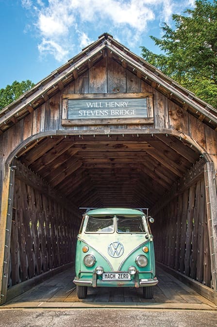 A vintage Volkswagen Bus is showcased under Will Henry Stevens bridge, just outside of Highlands, North Carolina.
