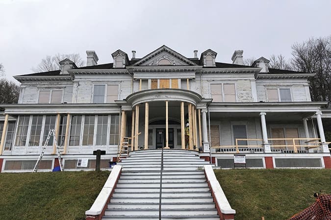 The weathered exterior of the mansion at the Moses Cone Memorial Park undergoes restoration and transformation. Completion is expected by the end of 2021.