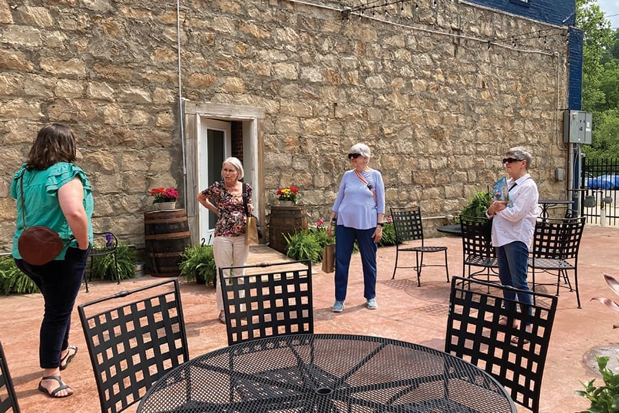 Hazard Downtown Development Coordinator Bailey Richards shows off the ArtStation Courtyard.
