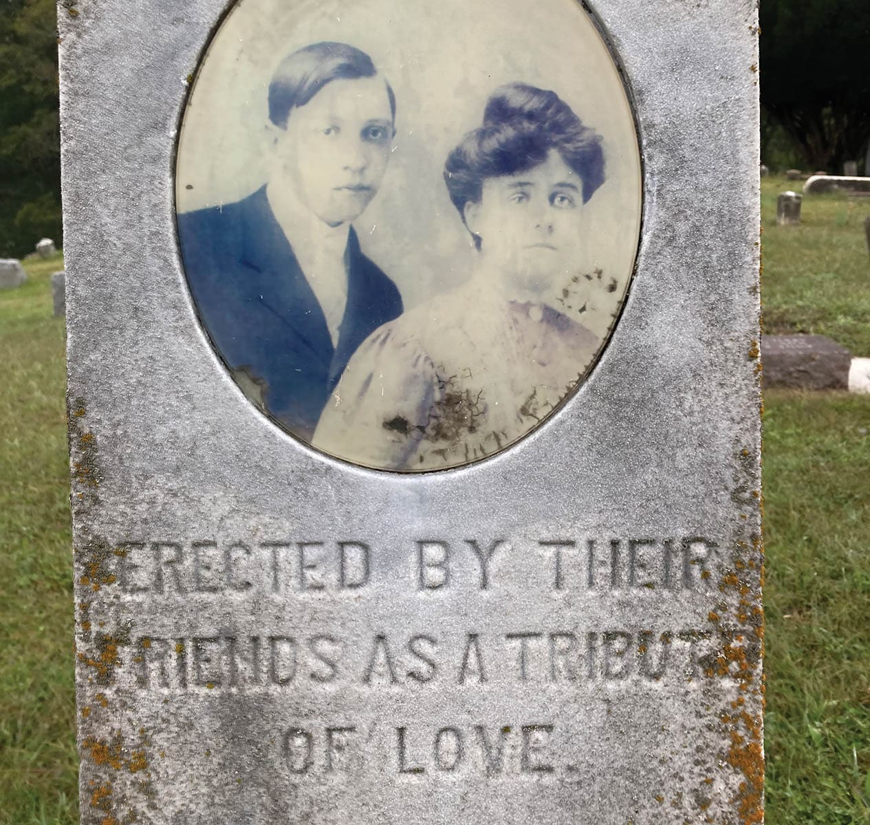 Portrait of Stuart Gay and Mabel Pendleton centered on the front of their shared tombstone.