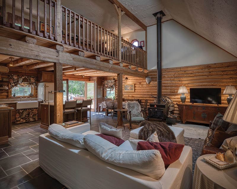 concept living area that opens onto the deck through a pair of French doors.
