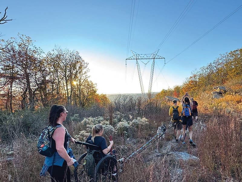 Fellow hikers accompany Pearson on the trek to McAfee.